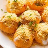 Dahi Puri · Small crispy Puris filled with potatoes & black channa topped with green & sweet chutneys, y...