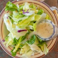 Tossed Green Dinner Salad And Tomatoes · Salad that has been tossed with dressing.