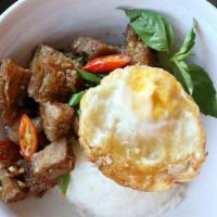Crispy Pork Kra Prow · Spicy. Fried pork belly stir-fried with Thai chili, garlic, green bean, red bell pepper, and...