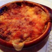 French Onion Soup · A crock of rich onions, topped with seasoned croutons, gruyere cheese, baked to a golden bro...