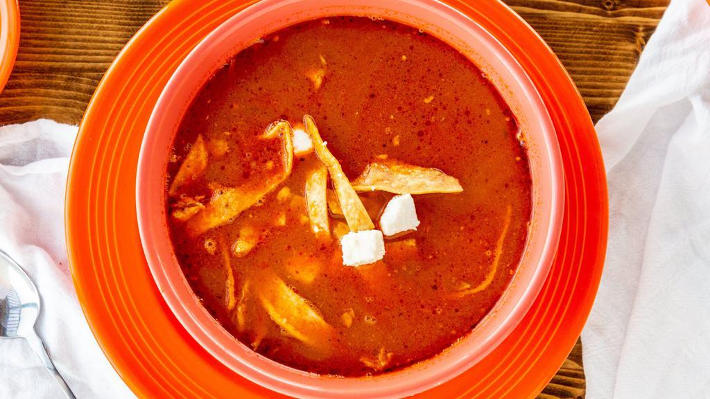 Tortilla Soup · Shredded chicken in a vegetable broth, served with avocado, queso fresco and tortilla strips
