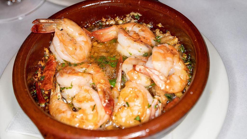 Gambas Al Ajillo · Shrimp sauteed with garlic and chili pod.