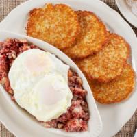 Homemade Corned Beef Hash · Blended with potatoes, onions, and heavy cream, topped with two eggs any style. Served with ...