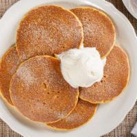 Pumpkin Pancakes · Dusted with cinnamon sugar, topped with real whipped cream. 700 cal.