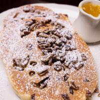 Pecan Pancakes · Dusted with powdered sugar. Served with whipped butter and tropical syrup. 1320 cal.