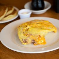 Irish Omelette · Stuffed with yellow cheddar cheese and our house-made hash, a blend of kosher corned beef, p...