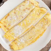 Shells Crepes · Three delicate plain crepes, dusted with powdered sugar served with lemon and whipped butter...
