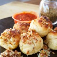 Garlic Knots · Our fantastic pizza dough baked fresh and tossed in olive oil and our special garlic and gra...
