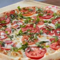Margherita Thin Crust Pizza · Mozzarella, Roma tomatoes, garlic and fresh basil. No sauce.