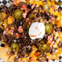 Nachos · Cheese, choice of meat, jalapenos, sour cream, black olives, cilantro, and famous red sauce.