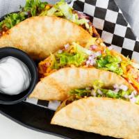 Taco · Served with choice of meat, tomatoes, cheese, and lettuce. Served with 2 flour tortillas wit...