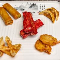 Combo Platter · An assortment of two egg rolls, two butterfly shrimps, two cheese wontons and two fried dump...
