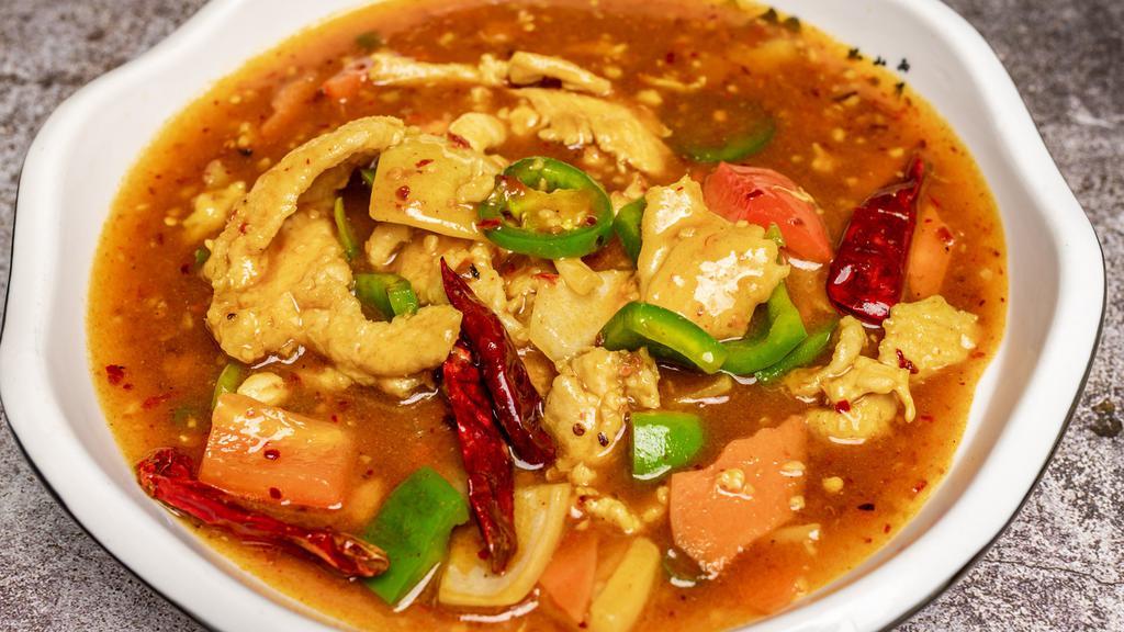 Curry Chicken · Sliced white meat chicken with carrots, diced bell pepper and onions stir-fried in a yellow curry sauce.