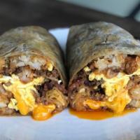 Breakfast Burrito · chorizo, bacon, tater tots, cheesy scrambled eggs, salsa roja