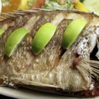 Mojarra Frita · Whole Tilapia Fish Deep Fried To A Crispy Texture
Includes Rice,Beans And Salad