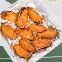 Chicken Wings · Buffalo style chicken wings coated with a flavorful tangy sauce.