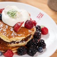 Lemon Tree Pancakes · made with ricotta cheese, lemon zest, fresh berries, raspberry syrup and mascarpone-whipped ...