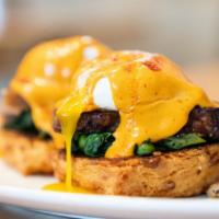 Wilbur Benedict · poached eggs over our homemade cheddar cheese biscuits, crispy pork belly, sautéed spinach, ...