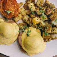Babe Benedict · poached eggs, toasted English muffin, Canadian bacon, and hollandaise sauce