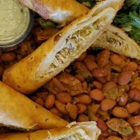 Chicken Flauta Plate · 2 chicken flautas served with Puerto Rican rice, beans and side of our caribbean slaw.