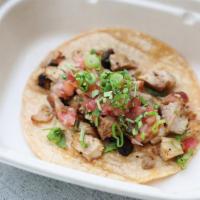 Chicken 'Street' Taco · Grilled Chicken with Salsa Verde, Onions, and Cilantro, in a Corn Tortilla. 1/4 pound taco.