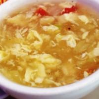 Egg Flower Soup · Served with egg, tomatoes, and tofu.