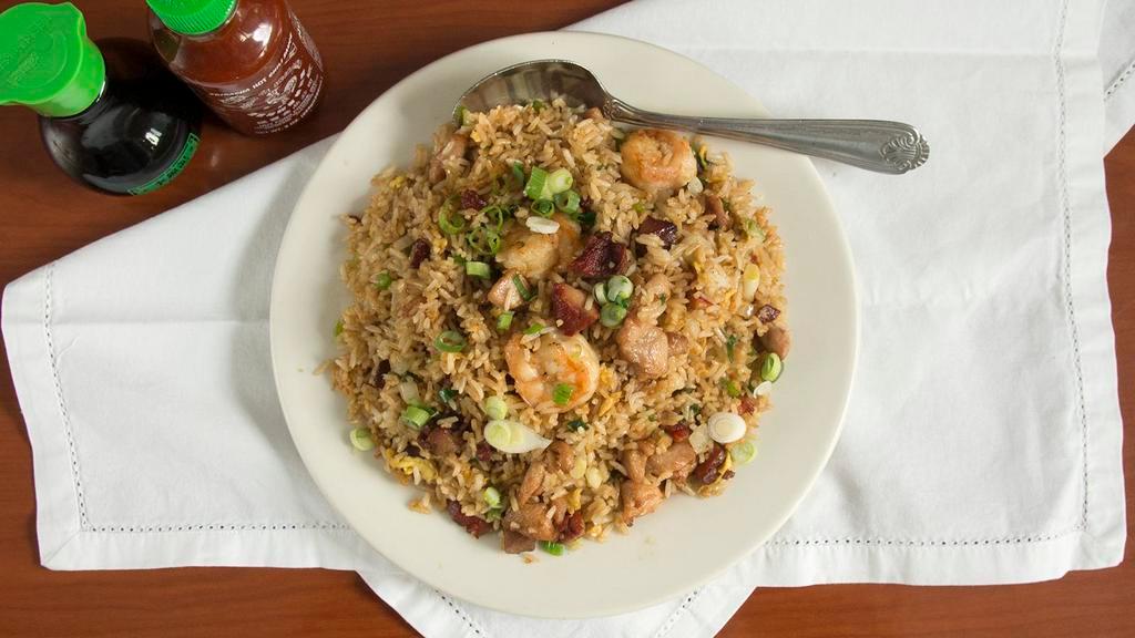House Special Fried Rice · Cooked with Chicken, BBQ Pork, Shrimp, Onions, and Egg.