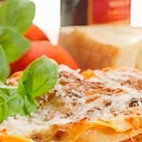 Meat Lasagna · Layers of pasta, ricotta cheese, and hearty halal meat sauce baked and covered with Mozzarel...