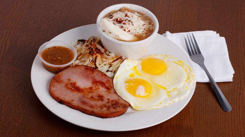 Hole In One Breakfast  · 2 Eggs With choice of ham, chorizo, turkey, sausage, or bacon with country potatoes and pot beans.
