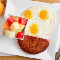 Corned Beef Hash & Eggs · Grilled corned beef served with three fresh eggs.