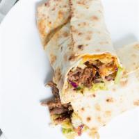 Beef Shawarma Wrap · Pita wrap with your choice of cabbage salad. Served with pickles and chili peppers. All shaw...