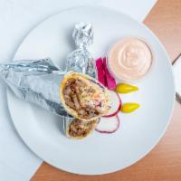 Lamb Shawarma Wrap · Pita wrap with your choice of cabbage salad. Served with pickles and chili peppers. All shaw...