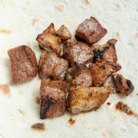 Pork Kabab Skewer · Four generous pieces. Served with a side of bread and garnish (red onion and cilantro).