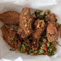 Garlic Wings (6) · Seasoned chicken wings tossed with bell peppers, fried garlic, jalapeño peppers, and green o...