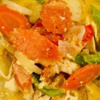 Yellow Curry · Yellow curry prepared with coconut milk, potatoes, onions, carrots, and bell peppers.