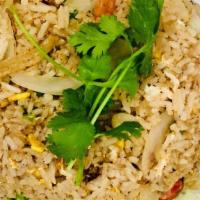 Thai Fried Rice · Jasmine rice stir fried with egg, tomatoes, white, and green onions, served with fresh slice...