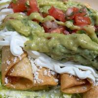 Flautas (4 Ct) · Con tortilla, chicken, cheese rolled, fried and served on a bed of shredded lettuce topped w...