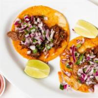 Taco De Birria · Birria meat, onion, cilantro.