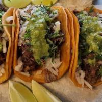 Traditional Street Tacos · All tacos come with cilantro, onion & sauce. Add cheese for an additional charge.