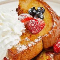 Abby’S French Toast  · Comes with four half sliced, topped strawberry, banana and powdered sugar.