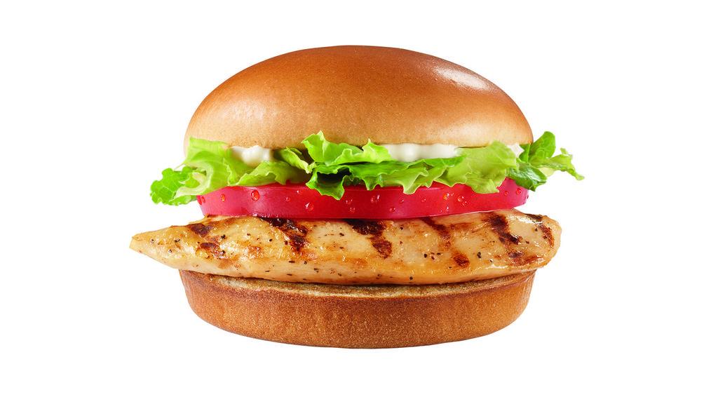 Grilled Chicken Sandwich · Juicy all-white meat chicken breast topped with crisp lettuce, ripe tomatoes, and salad dressing on a toasted bun.
