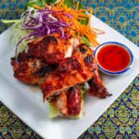 Thai Bbq Chicken · Charbroiled chicken marinated in our homemade Thai BBQ sauce.
