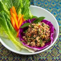 Chicken Larb* · Minced chicken, mint leaves,chili and lime juice, and roasted rice powder. Served with heart...