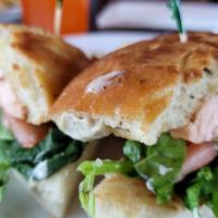 Salmon Sandwich · Grilled Salmon, dill aioli, spinach, tomato on focaccia bread.