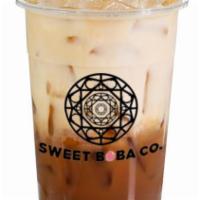 White Chocolate Coffee · Our house coffee and milk with white chocolate over ice!
