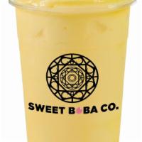 Pineapple Mango Smoothie · Fresh mango and pineapple blended with our house milk!