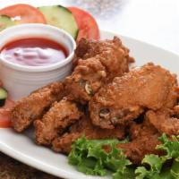 Crispy Chicken Wings · Marinated & seasoned crispy fried chicken wings. Serving for two to three.