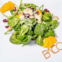 Mandarin Bistro Salad · Nut allergy, paleo, vegetarian, vegan option. Spinach, dried berries and herbs, parmesan and...