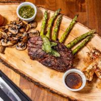 Surf And Turf Board (3) · Rib eye, filet mignon, shrimp, lobster, asparagus, tomato and blue cheese.
