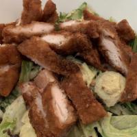 Fried Chicken Salad · Bite-size chicken fingers on a bed of salad greens with cheddar cheese, diced tomato and egg...